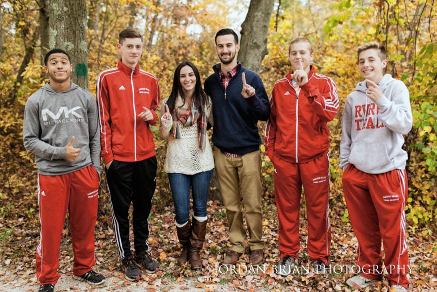 Rancocas Valley cross-country team photobombing fall engagement session at Smithville